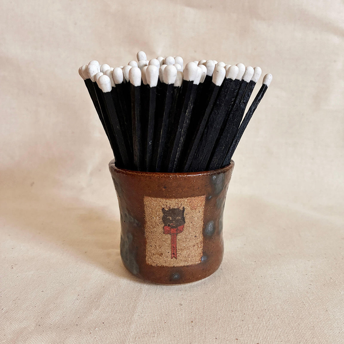 Chestnut brown Match Pot with a cat decal