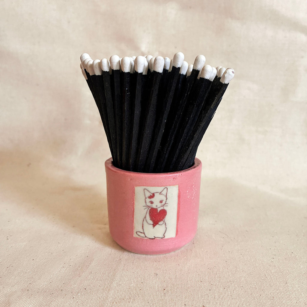 Pink Match Pot with a cat decal and striker panel