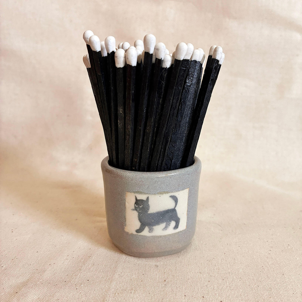 Sage Match Pot with a cat decal and striker panel