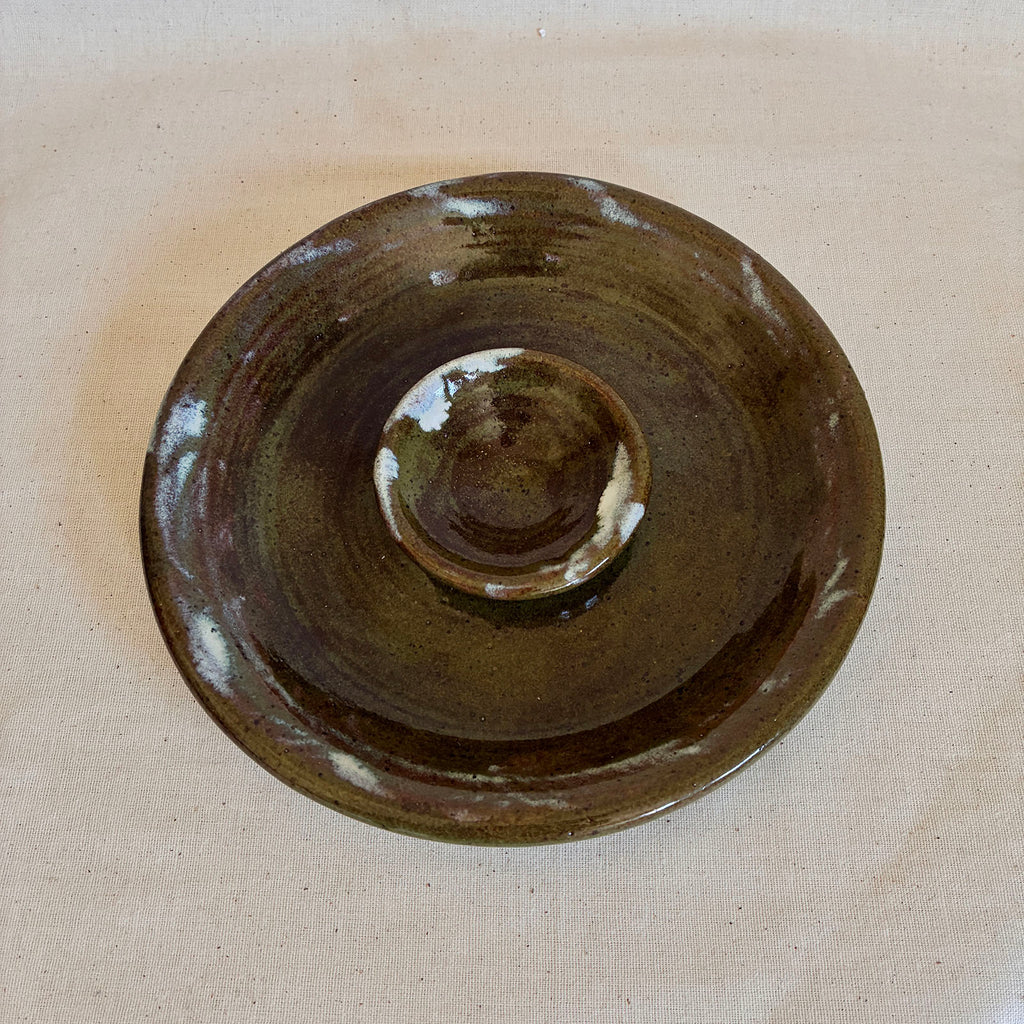 Olive-green and brown glazed olive dish with white flashes