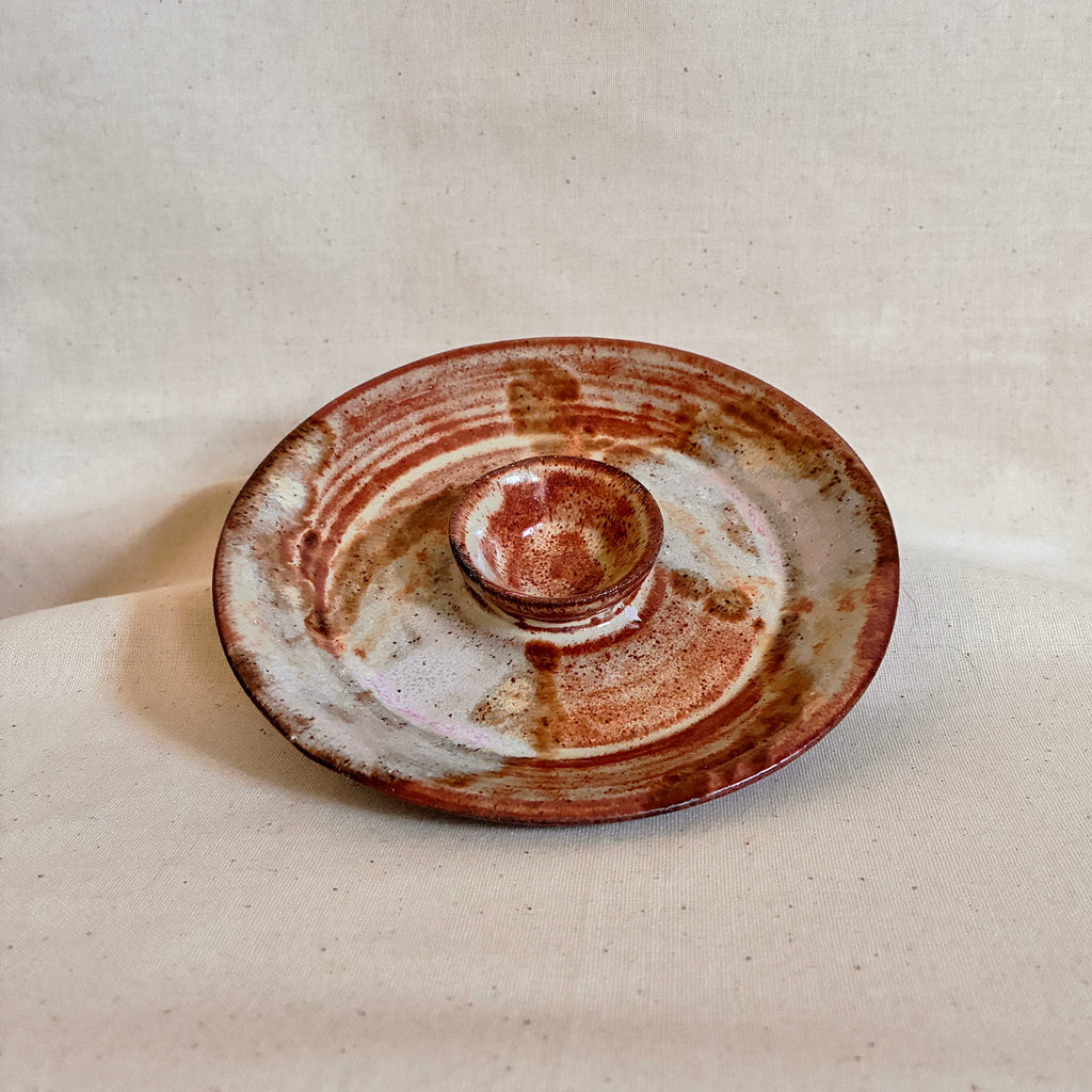 Creamsicle olive dish with variegated shino glaze and hints of pink