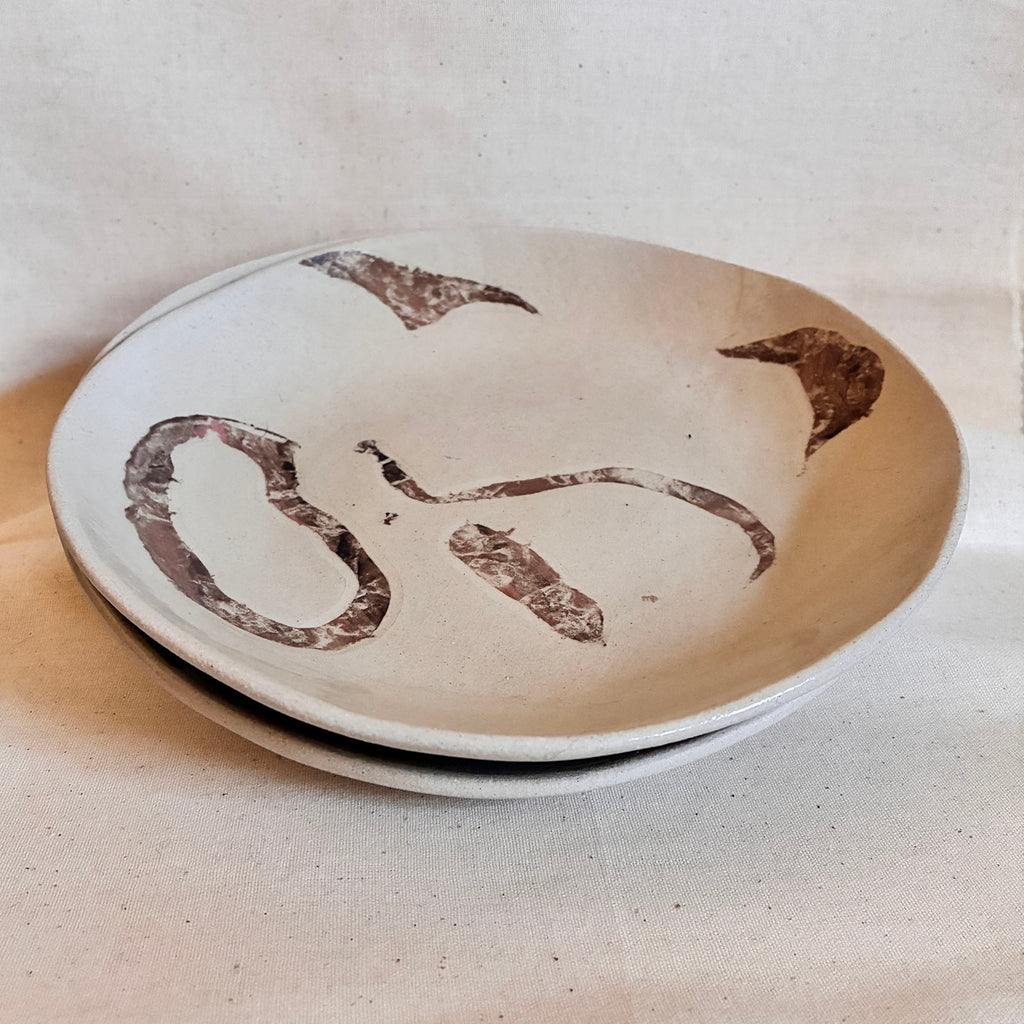 Pair of Rocky Road pasta plates with brown and pink marbled design