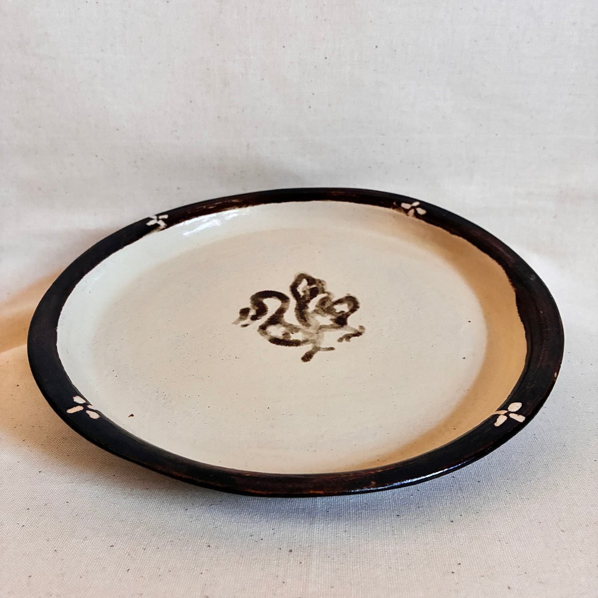 Cream Rimmed Plate with tenmoku-brown rim and painted goose design